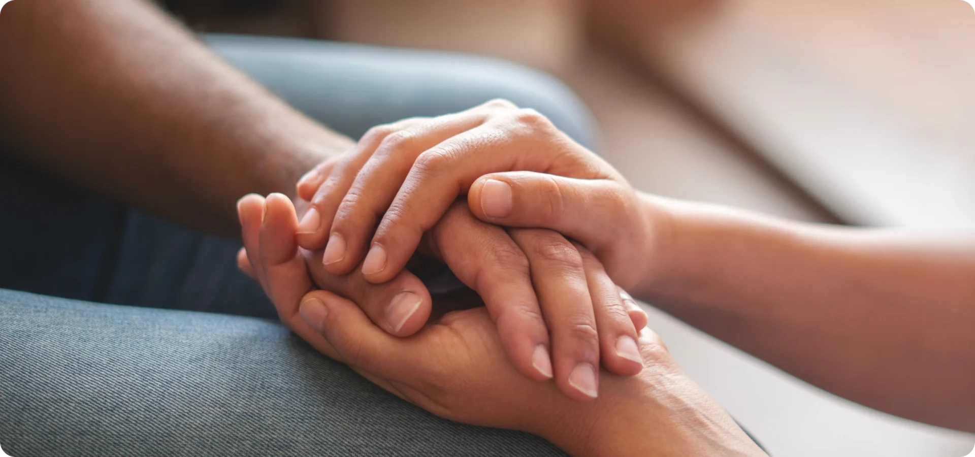 Hands offering comfort and support