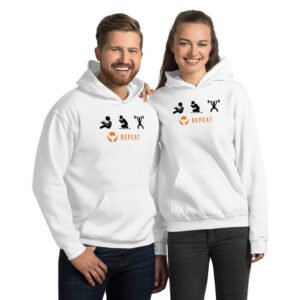 Smiling couple in matching white Repeat hoodies