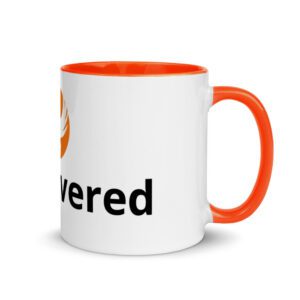 White mug with orange handle and interior